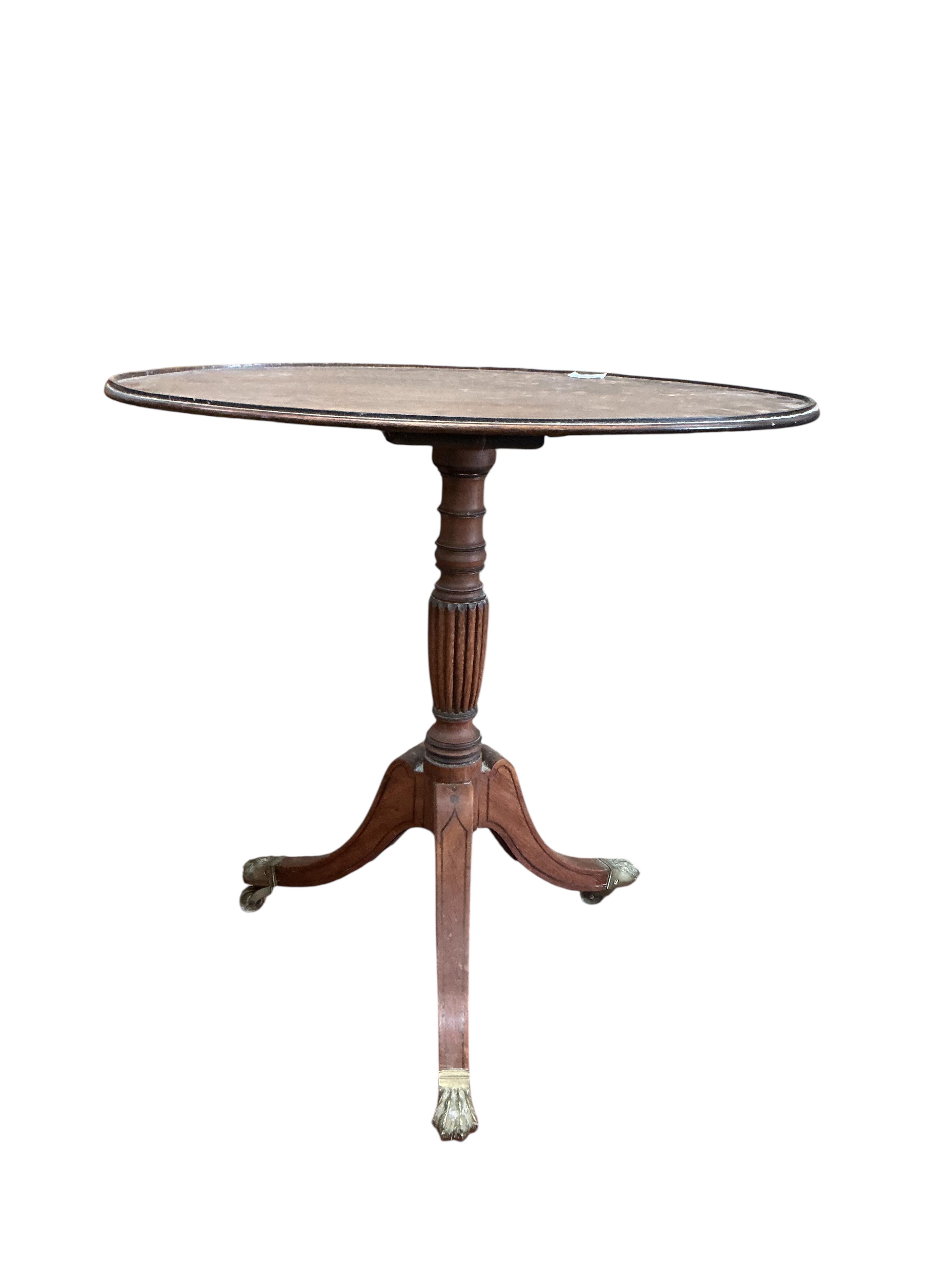 A Regency oval mahogany tripod wine table, width 70cm, depth 49cm, height 72cm